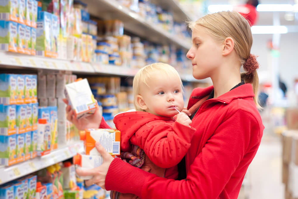 mother with baby in market